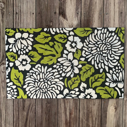 An old doormat and some acrylic paint — Can you say upcycle?